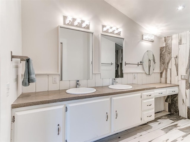 bathroom featuring double vanity
