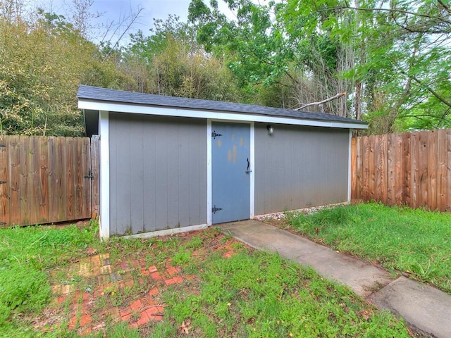view of shed featuring a fenced backyard