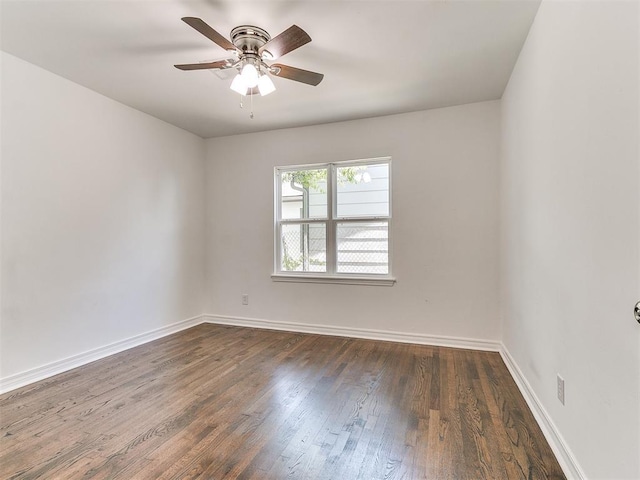 213 E Haddock St, Norman, OK 73069 - spare room with dark wood-style floors, baseboards, and ceiling fan
