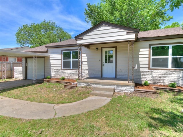213 E Haddock St, Norman, OK 73069 - view of front of house featuring an attached garage and asphalt driveway