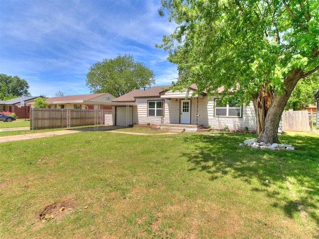 213 E Haddock St, Norman, OK 73069 - single story home with driveway, an attached garage, and stone siding