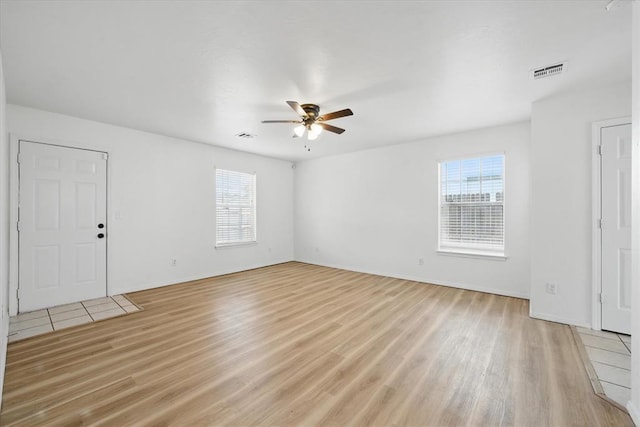 236 NW 91st St, Oklahoma City, OK 73114 - empty room featuring ceiling fan, light wood-style floors, and baseboards