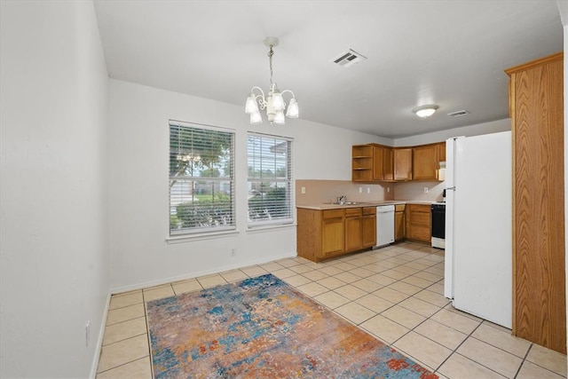 236 NW 91st St, Oklahoma City, OK 73114 - kitchen with white appliances, light tile patterned flooring, open shelves, a chandelier, and light countertops