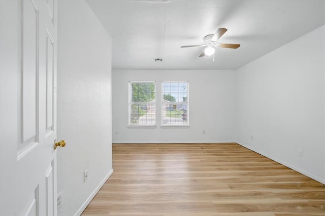 236 NW 91st St, Oklahoma City, OK 73114 - spare room featuring a ceiling fan, light wood finished floors, and baseboards