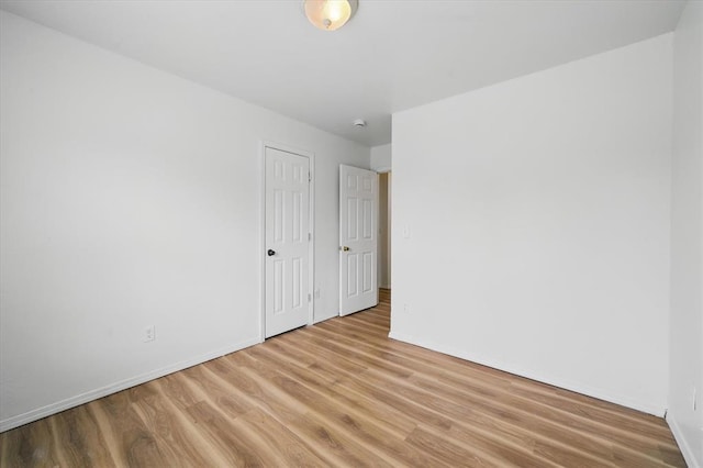 236 NW 91st St, Oklahoma City, OK 73114 - empty room with wood finished floors and baseboards