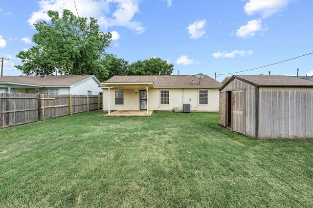 236 NW 91st St, Oklahoma City, OK 73114 - back of house featuring a patio area, central AC, a storage shed, and an outdoor structure