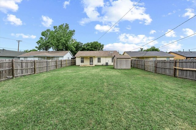 236 NW 91st St, Oklahoma City, OK 73114 - view of yard featuring a shed and an outbuilding