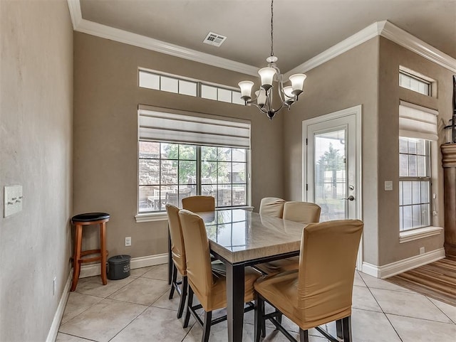 12515 Forest Oaks Dr, Choctaw, OK 73020 - dining area with crown molding, a chandelier, light tile patterned flooring, and baseboards