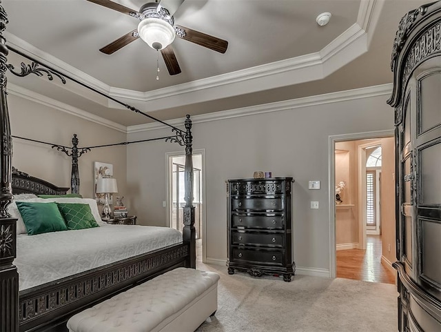 12515 Forest Oaks Dr, Choctaw, OK 73020 - bedroom featuring multiple windows, light carpet, crown molding, a raised ceiling, and a ceiling fan