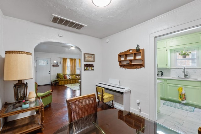 2017 NE 20th St, Oklahoma City, OK 73111 - home office featuring a sink, arched walkways, and crown molding