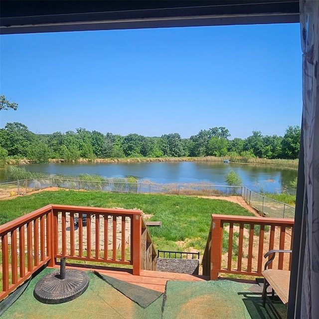 wooden terrace with a water view