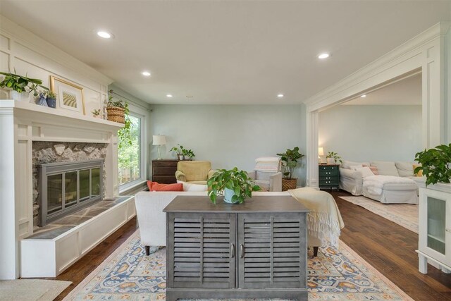 11412 Leaning Elm Rd, Oklahoma City, OK 73120 - living area featuring wood finished floors, a fireplace, and recessed lighting