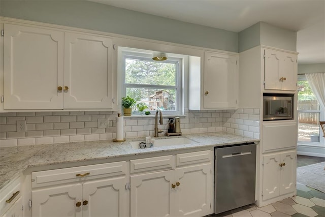 11412 Leaning Elm Rd, Oklahoma City, OK 73120 - kitchen featuring appliances with stainless steel finishes, a sink, and white cabinetry