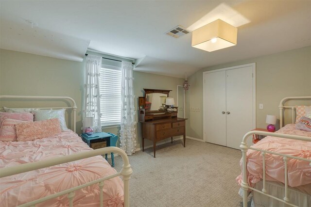 11412 Leaning Elm Rd, Oklahoma City, OK 73120 - bedroom with light colored carpet, a closet, and baseboards