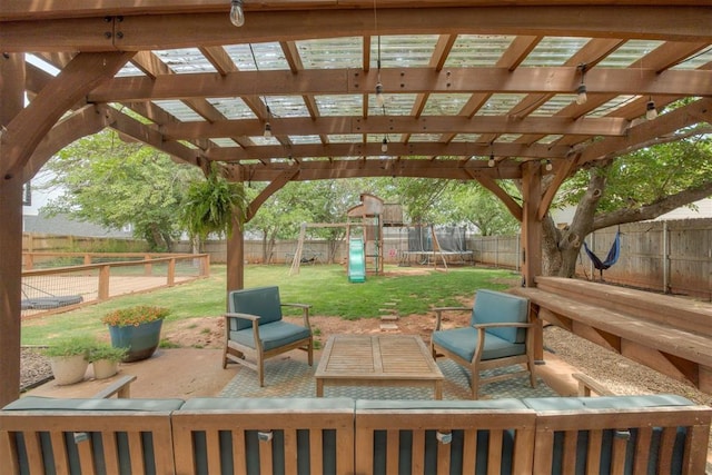 11412 Leaning Elm Rd, Oklahoma City, OK 73120 - view of patio / terrace featuring an outdoor living space, a trampoline, a playground, and a pergola