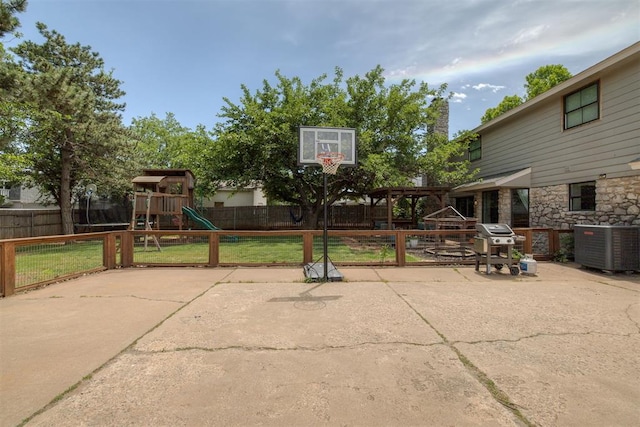 11412 Leaning Elm Rd, Oklahoma City, OK 73120 - view of patio featuring a playground, cooling unit, and a grill