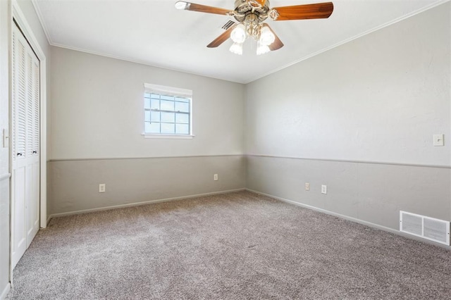 1500 S Railroad, Marlow, OK 73055 - unfurnished bedroom featuring carpet, baseboards, a closet, ornamental molding, and a ceiling fan