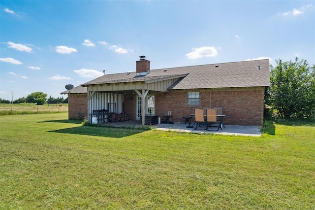 1500 S Railroad, Marlow, OK 73055 - back of property featuring a patio, brick siding, a lawn, and a chimney