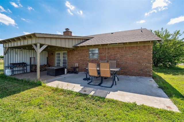 1500 S Railroad, Marlow, OK 73055 - back of house with french doors, a patio area, a yard, and brick siding
