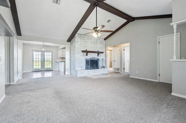 1500 S Railroad, Marlow, OK 73055 - unfurnished living room featuring a fireplace, ceiling fan, carpet, beamed ceiling, and baseboards