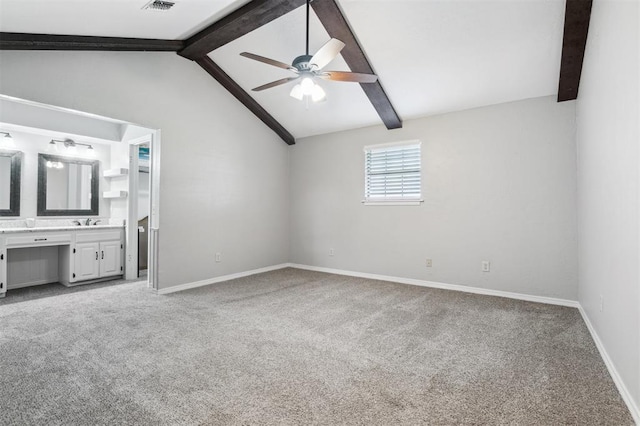 1500 S Railroad, Marlow, OK 73055 - unfurnished bedroom with light colored carpet, baseboards, connected bathroom, a sink, and ceiling fan