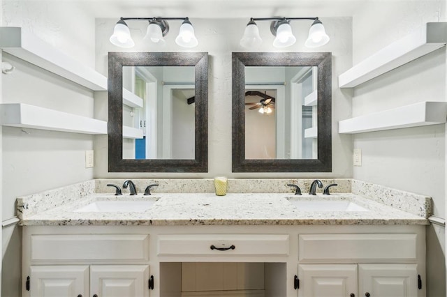 1500 S Railroad, Marlow, OK 73055 - bathroom featuring double vanity and ceiling fan