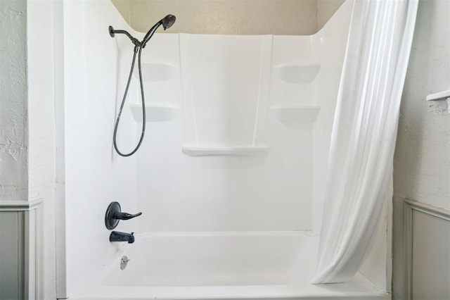 1500 S Railroad, Marlow, OK 73055 - full bath featuring shower / bath combo with shower curtain and a textured wall