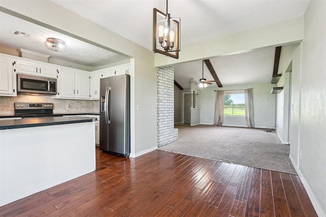 1500 S Railroad, Marlow, OK 73055 - kitchen featuring stainless steel appliances, white cabinetry, dark wood-style flooring, dark countertops, and baseboards