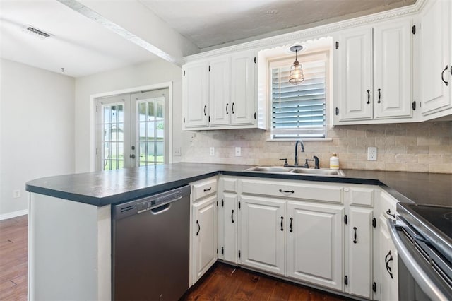 1500 S Railroad, Marlow, OK 73055 - kitchen with stainless steel appliances, a sink, dark countertops, and dark wood-style floors