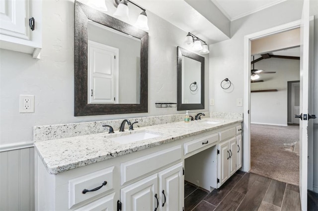 1500 S Railroad, Marlow, OK 73055 - full bathroom featuring double vanity, a ceiling fan, wood finished floors, and ornamental molding