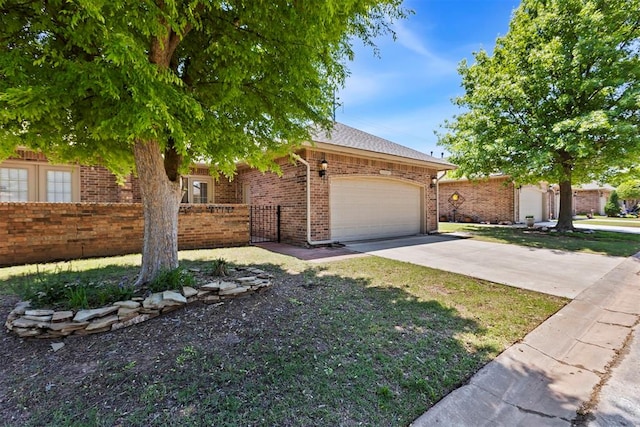 view of front of house featuring a garage, fence, concrete driveway, and brick siding