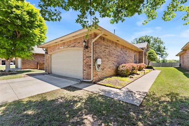 view of home's exterior with driveway, an attached garage, and brick siding
