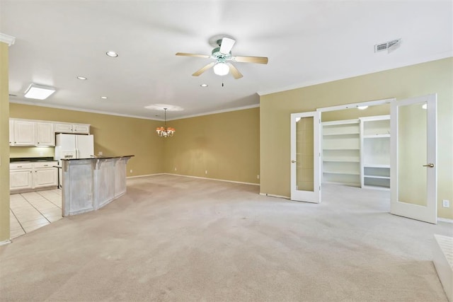 unfurnished living room with light colored carpet, ceiling fan, baseboards, ornamental molding, and recessed lighting
