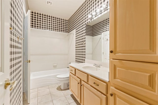 bathroom featuring wallpapered walls, toilet, vanity, shower / bathtub combination, and tile patterned floors