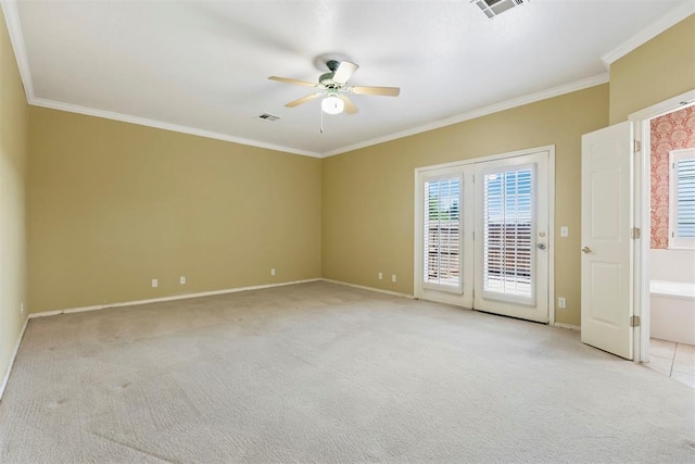 unfurnished room featuring a ceiling fan, ornamental molding, light carpet, and baseboards