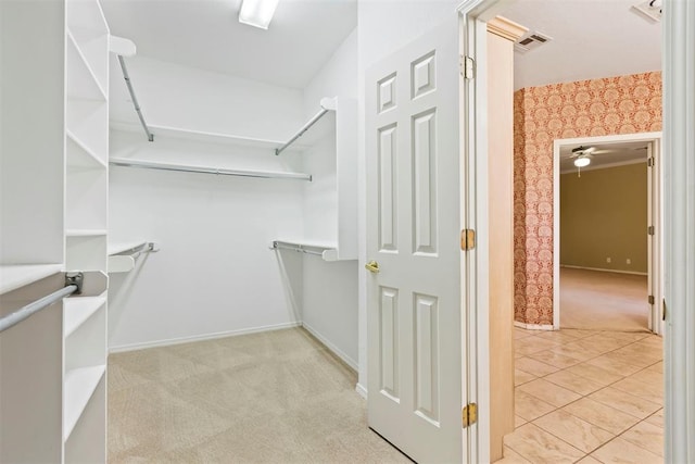 spacious closet featuring carpet floors and ceiling fan