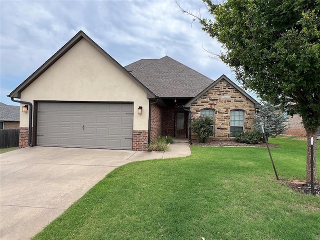 2408 Santa Monica St, Edmond, OK 73034 - view of front facade with a front yard, driveway, a garage, and stucco siding