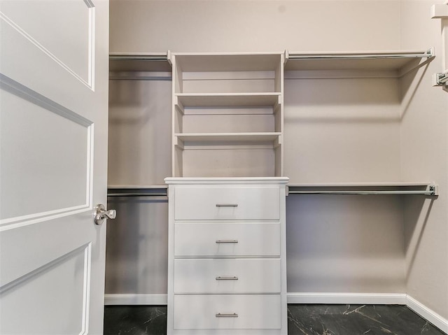 2408 Santa Monica St, Edmond, OK 73034 - walk in closet featuring marble look tile flooring