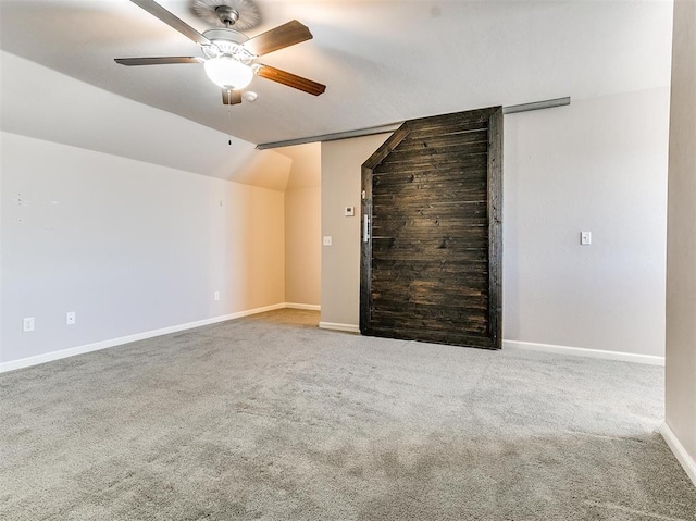2408 Santa Monica St, Edmond, OK 73034 - unfurnished living room with vaulted ceiling, carpet floors, a ceiling fan, and baseboards