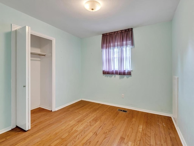 6120 Kingston Rd, Oklahoma City, OK 73122 - unfurnished bedroom featuring wood finished floors, a closet, and baseboards