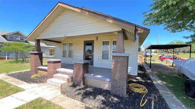 123 S 4th St, Sentinel, OK 73664 - view of front facade with a porch and a carport