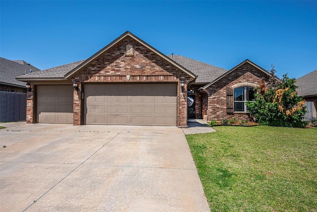 805 Evening Dr, Yukon, OK 73099 - view of front of property with brick siding, concrete driveway, a garage, and a front lawn