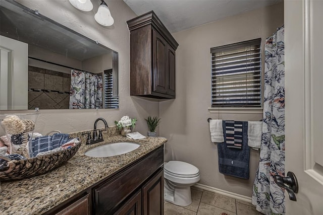 805 Evening Dr, Yukon, OK 73099 - full bathroom with vanity, toilet, tile patterned flooring, curtained shower, and baseboards