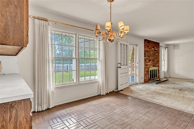unfurnished living room featuring a chandelier and a fireplace