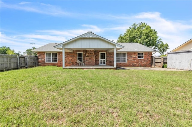 rear view of house with brick siding