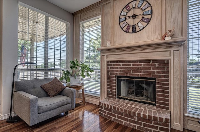 3001 NE 129th St, Edmond, OK 73013 - living area featuring dark wood finished floors, a fireplace, and healthy amount of natural light