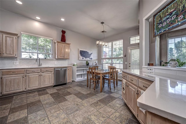 3001 NE 129th St, Edmond, OK 73013 - kitchen with stainless steel dishwasher, a sink, stone tile floors, light countertops, and recessed lighting