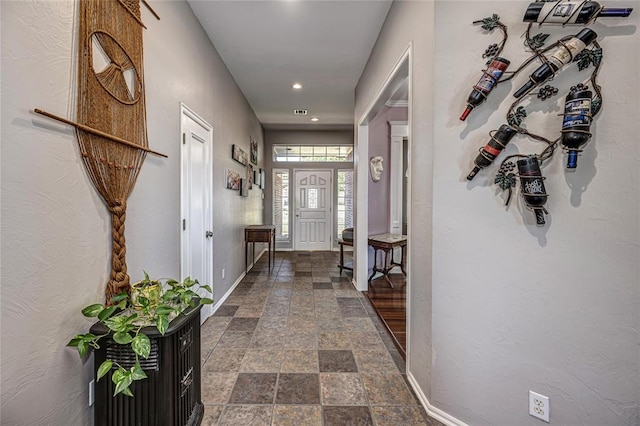 3001 NE 129th St, Edmond, OK 73013 - entryway with dark stone finish floors, baseboards, and recessed lighting
