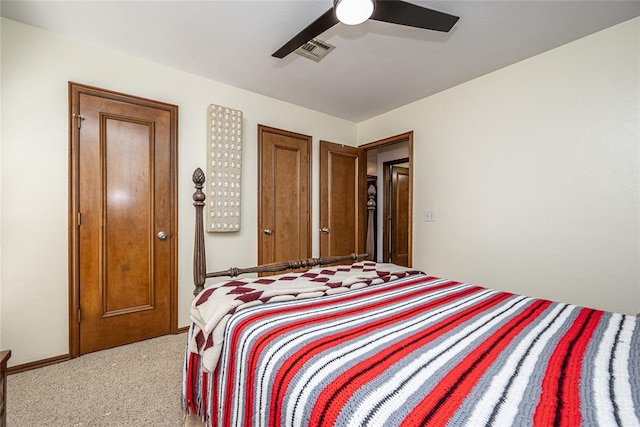3001 NE 129th St, Edmond, OK 73013 - bedroom with light colored carpet and a ceiling fan