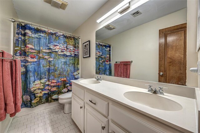 3001 NE 129th St, Edmond, OK 73013 - full bathroom with toilet, double vanity, tile patterned flooring, and a shower with shower curtain